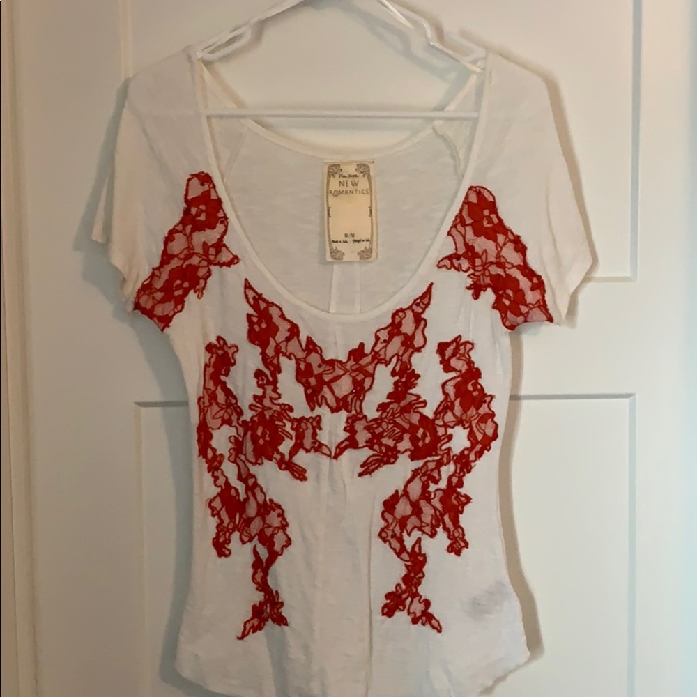 Free People top with lace and bead detail. Size M